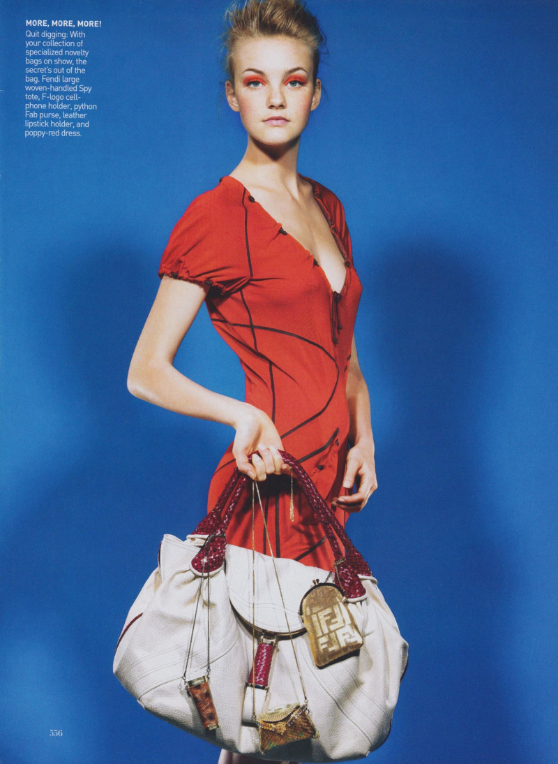 Caroline Trentini featured in Power Trend: Extra, Extra! - 1. Double Bag It, March 2005