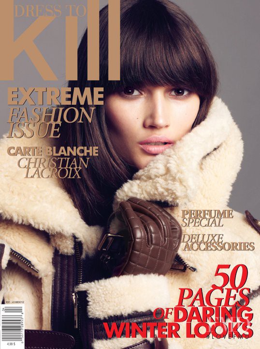 Tara Gill featured on the Dress To Kill Magazine cover from December 2010