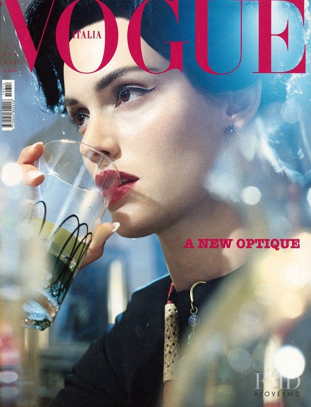 Amber Valletta featured on the Vogue Italy cover from October 2001