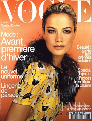 Carolyn Murphy featured on the Vogue France cover from July 2000