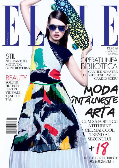 Simona Bitiusca featured on the Elle Romania cover from March 2014