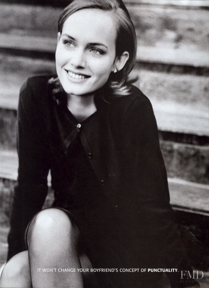 Amber Valletta featured in  the Redken advertisement for Spring 1995