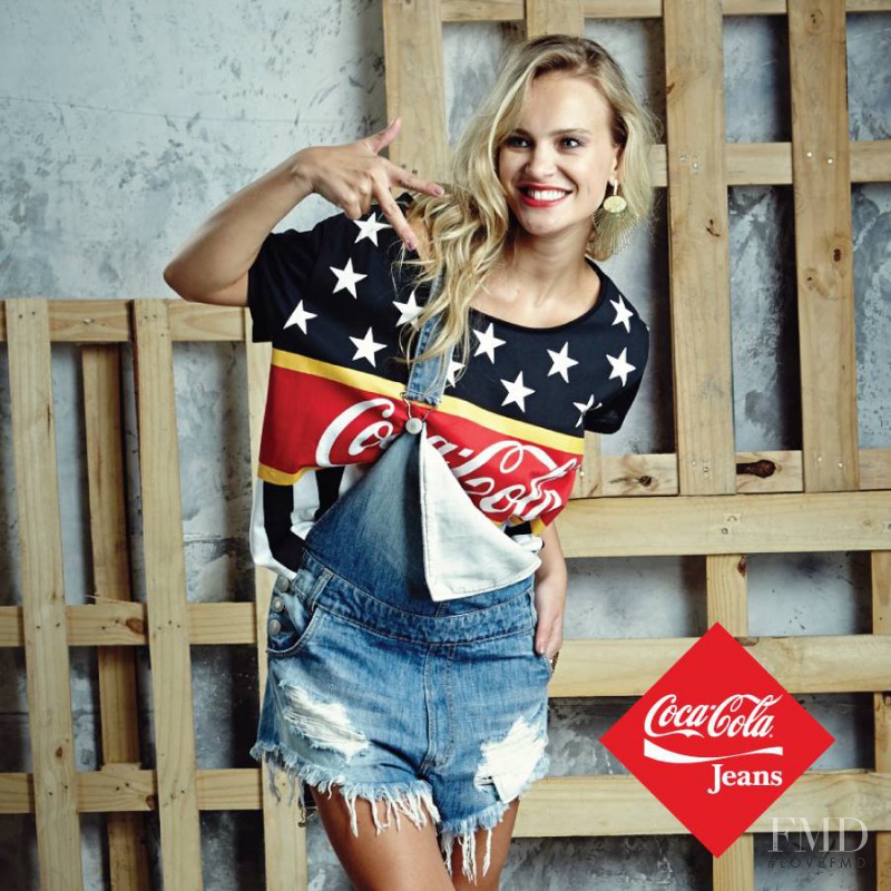 Elisandra Tomacheski featured in  the Coca-Cola Clothing advertisement for Autumn/Winter 2014