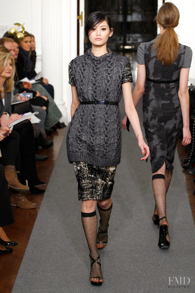 Ming Xi featured in  the Ports 1961 fashion show for Autumn/Winter 2011