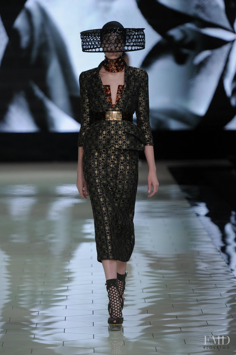Alexandra Martynova featured in  the Alexander McQueen fashion show for Spring/Summer 2013
