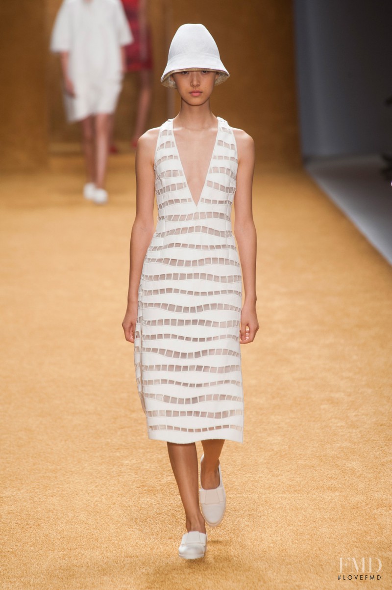 Tian Yi featured in  the Akris fashion show for Spring/Summer 2014