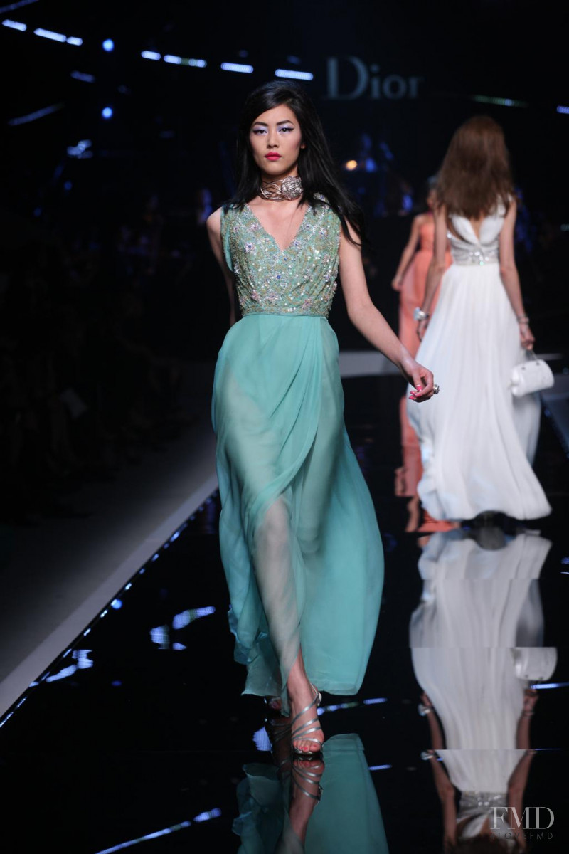 Liu Wen featured in  the Christian Dior fashion show for Cruise 2011