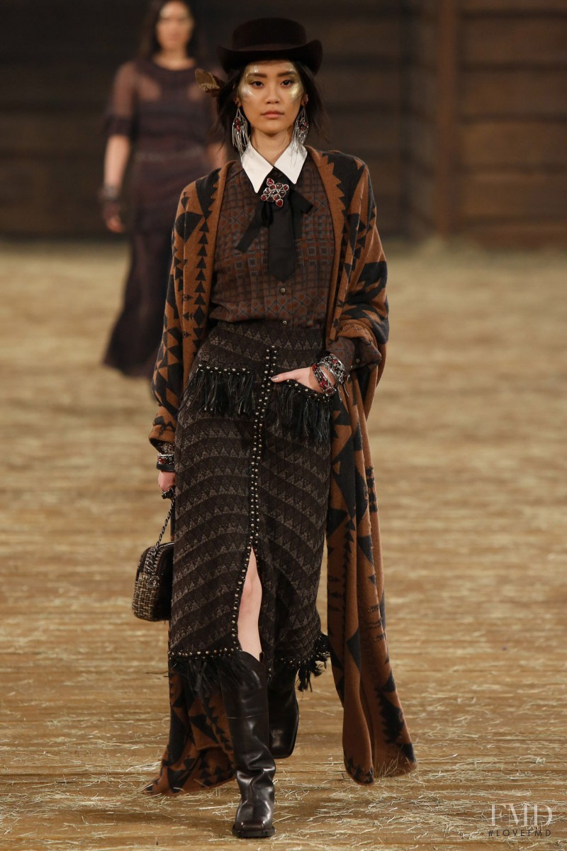 Ming Xi featured in  the Chanel fashion show for Pre-Fall 2014