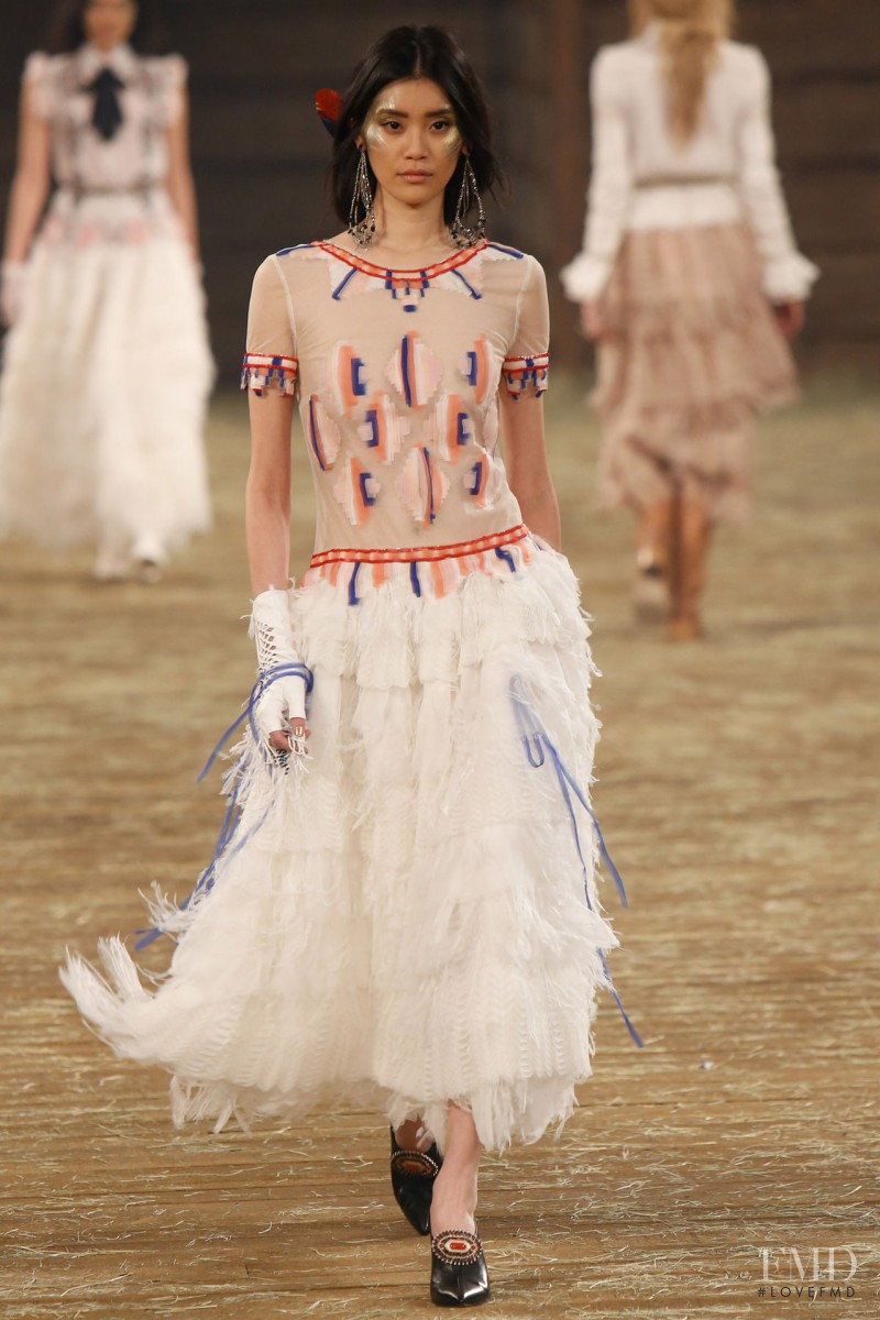 Ming Xi featured in  the Chanel fashion show for Pre-Fall 2014