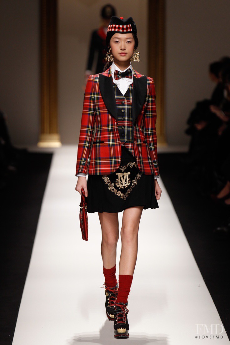 Tian Yi featured in  the Moschino fashion show for Autumn/Winter 2013