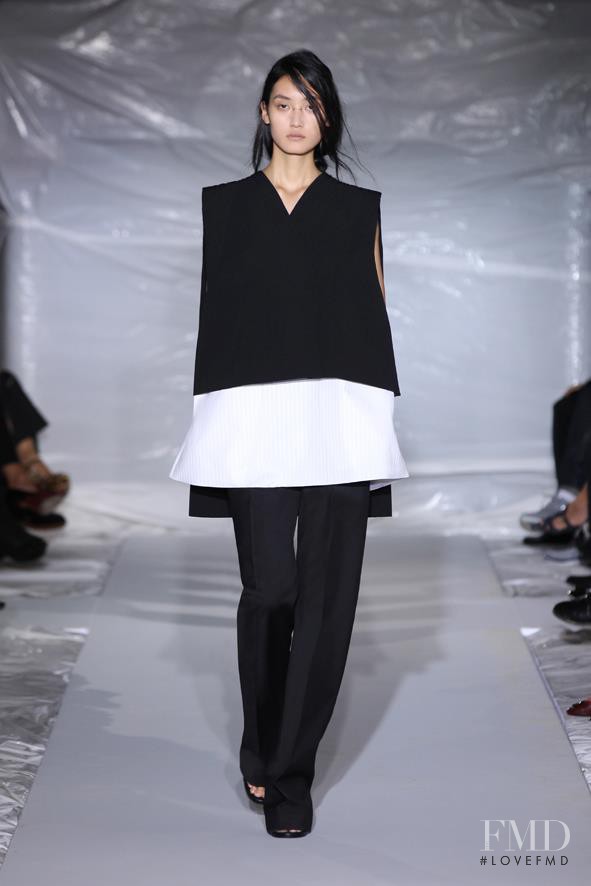 Lina Zhang featured in  the Maison Martin Margiela fashion show for Spring/Summer 2013