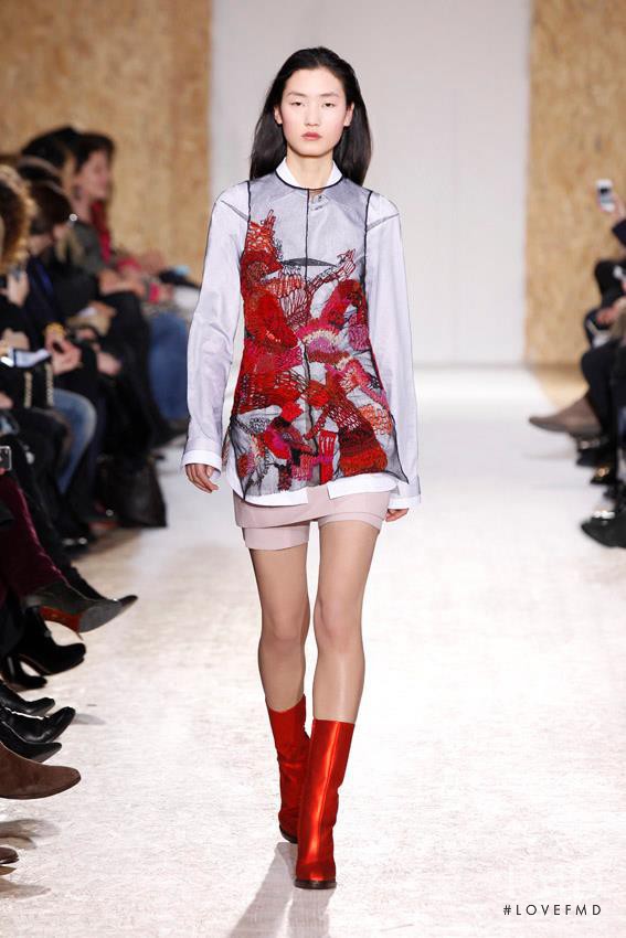 Lina Zhang featured in  the Maison Martin Margiela fashion show for Autumn/Winter 2013