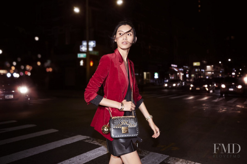 Ming Xi featured in  the Michael Kors Collection The Walk advertisement for Holiday 2016