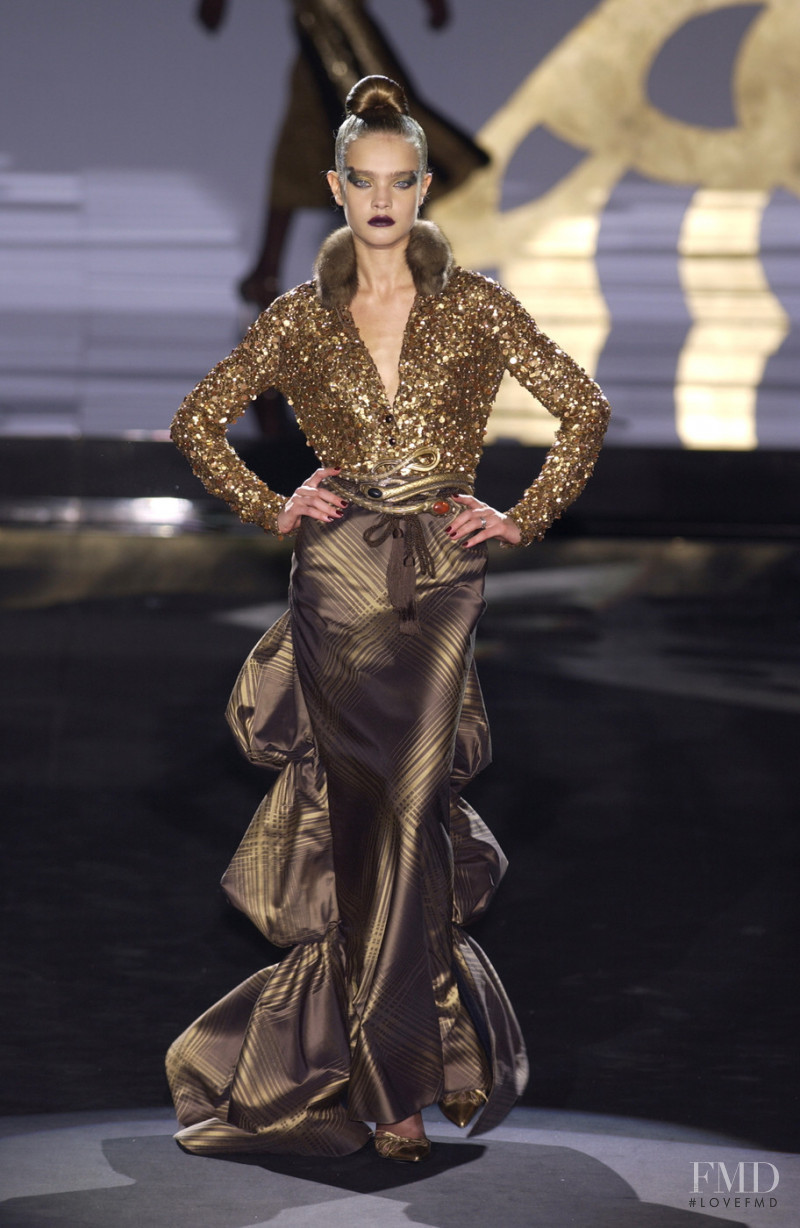 Natalia Vodianova featured in  the Valentino Couture fashion show for Autumn/Winter 2002