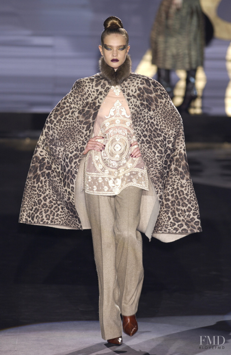 Natalia Vodianova featured in  the Valentino Couture fashion show for Autumn/Winter 2002
