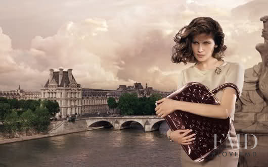 Laetitia Casta featured in  the Louis Vuitton "Core Values" Handbags advertisement for Autumn/Winter 2008
