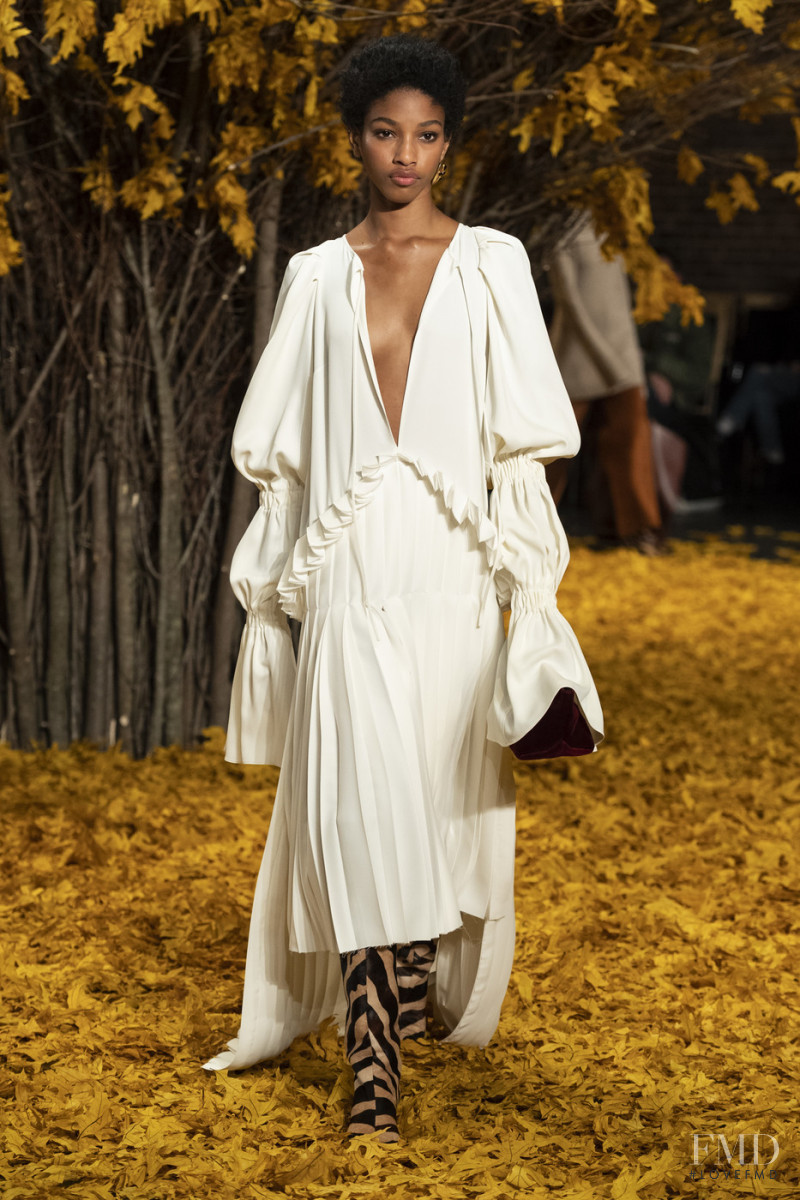 Naomi Chin Wing featured in  the Khaite fashion show for Autumn/Winter 2019