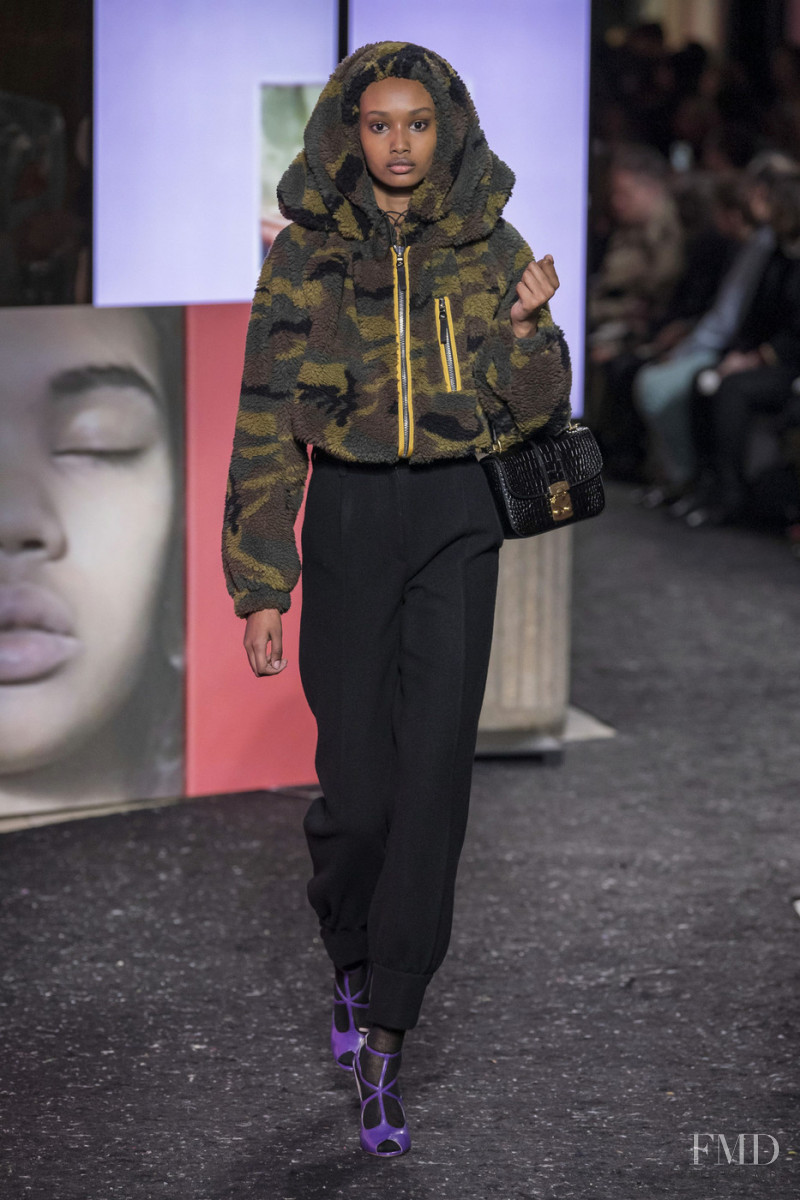 Ugbad Abdi featured in  the Miu Miu fashion show for Autumn/Winter 2019