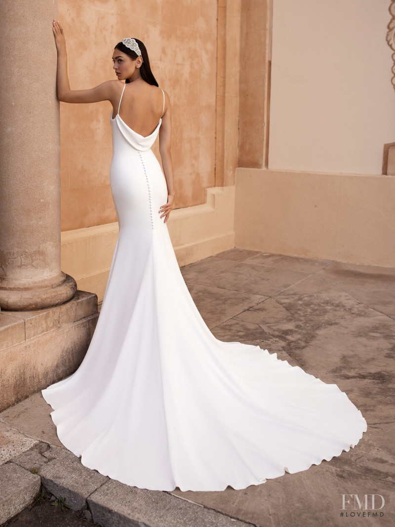 Zhenya Katava featured in  the Pronovias catalogue for Summer 2019