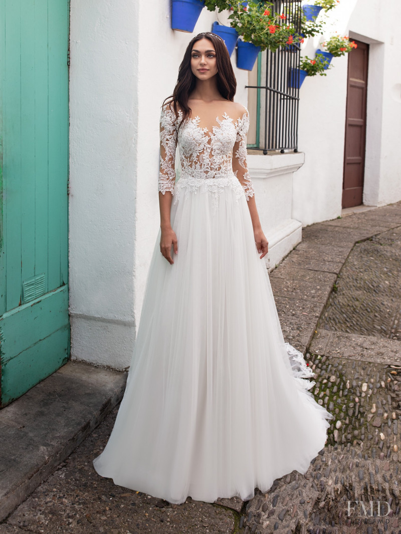 Zhenya Katava featured in  the Pronovias catalogue for Summer 2019