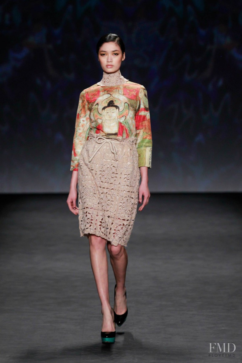 Qi Wen featured in  the Vivienne Tam fashion show for Autumn/Winter 2014