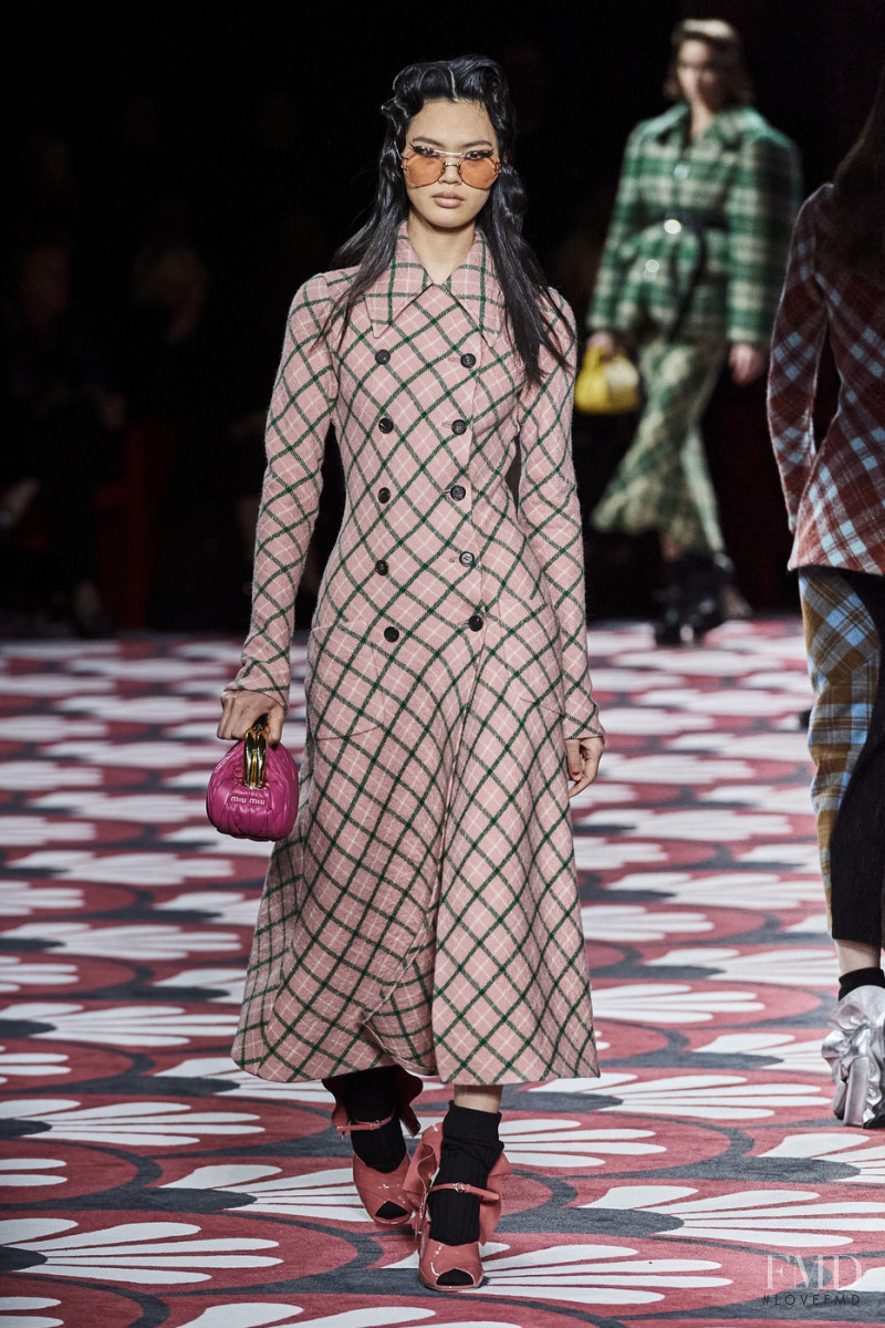 Qun Ye featured in  the Miu Miu fashion show for Autumn/Winter 2020