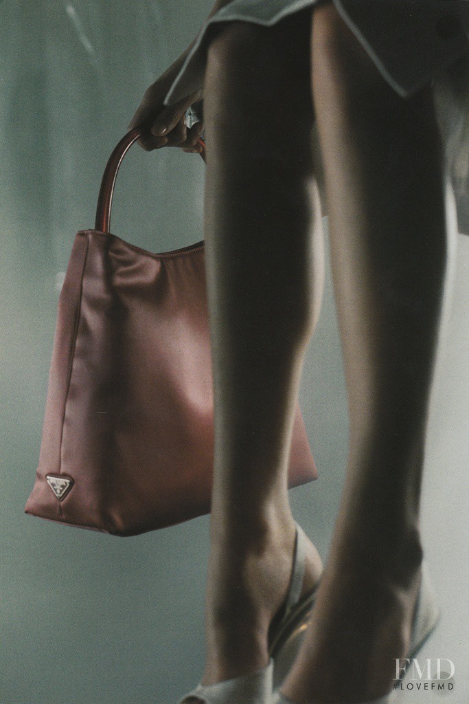 Amber Valletta featured in  the Prada advertisement for Spring/Summer 1998