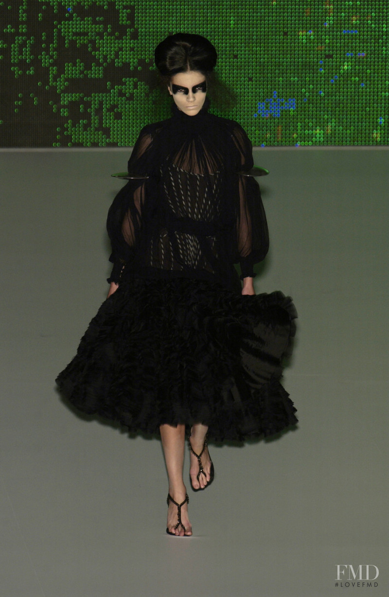 Mariacarla Boscono featured in  the Alexander McQueen fashion show for Spring/Summer 2003