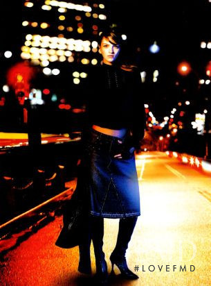 Mariacarla Boscono featured in  the DKNY advertisement for Autumn/Winter 2002