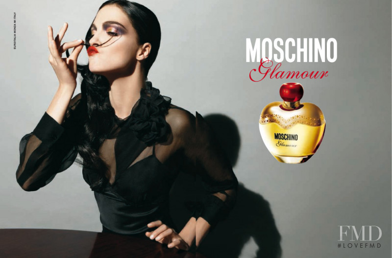 Mariacarla Boscono featured in  the Moschino Fragrance Glamour advertisement for Winter 2008