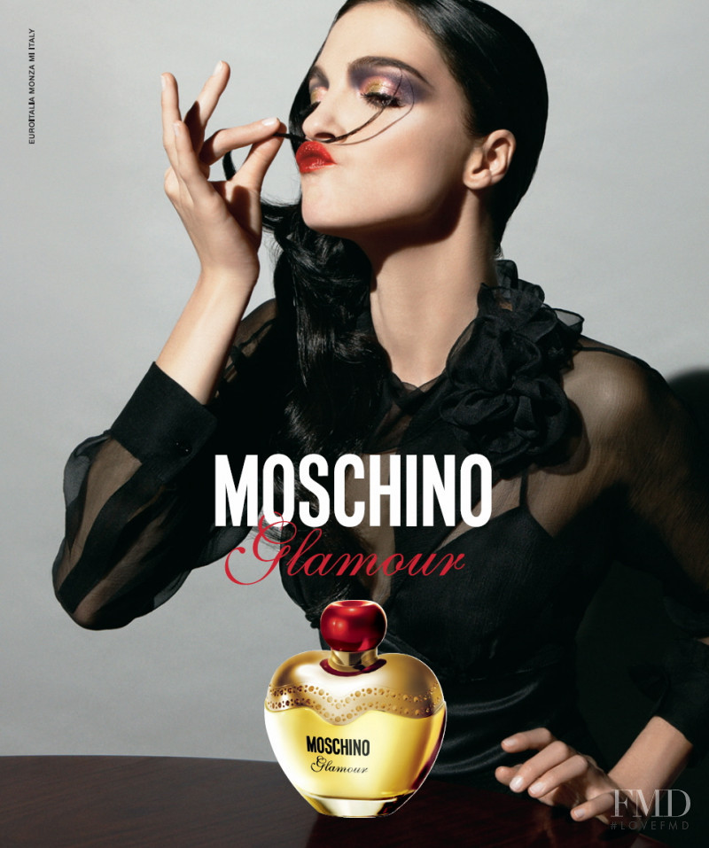 Mariacarla Boscono featured in  the Moschino Fragrance Glamour advertisement for Winter 2008