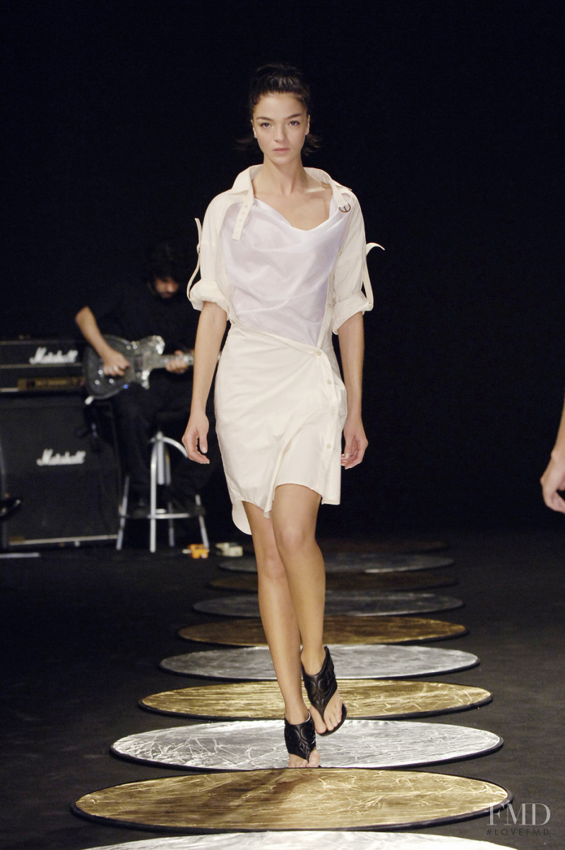 Mariacarla Boscono featured in  the Hussein Chalayan fashion show for Spring/Summer 2006