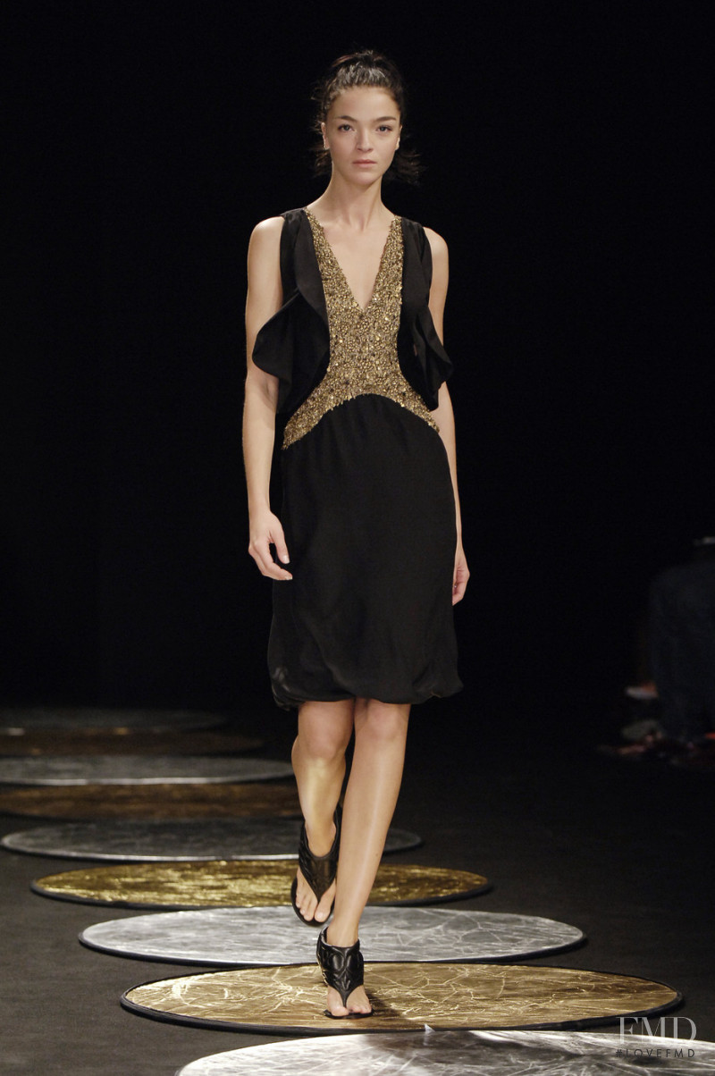 Mariacarla Boscono featured in  the Hussein Chalayan fashion show for Spring/Summer 2006