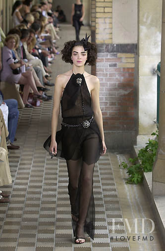 Mariacarla Boscono featured in  the Chanel Haute Couture fashion show for Autumn/Winter 2001