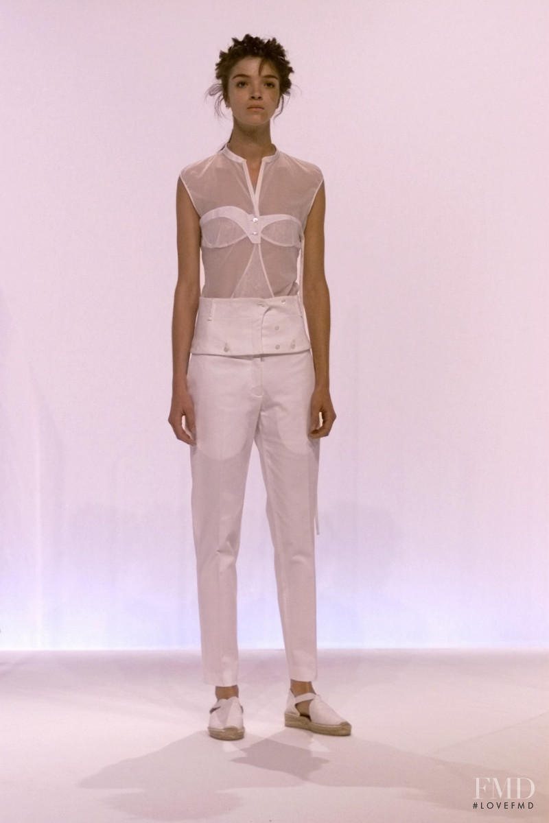 Mariacarla Boscono featured in  the Hussein Chalayan fashion show for Spring/Summer 2002