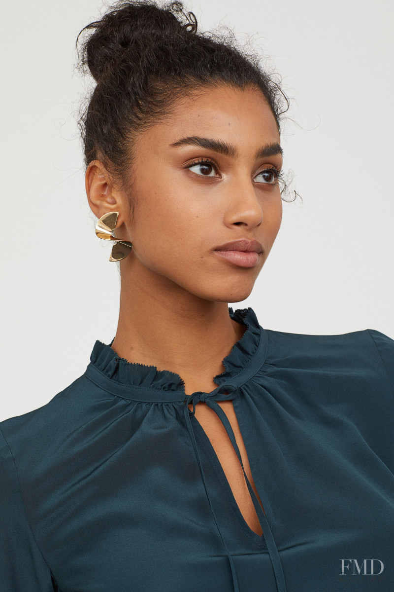 Imaan Hammam featured in  the H&M catalogue for Pre-Fall 2018