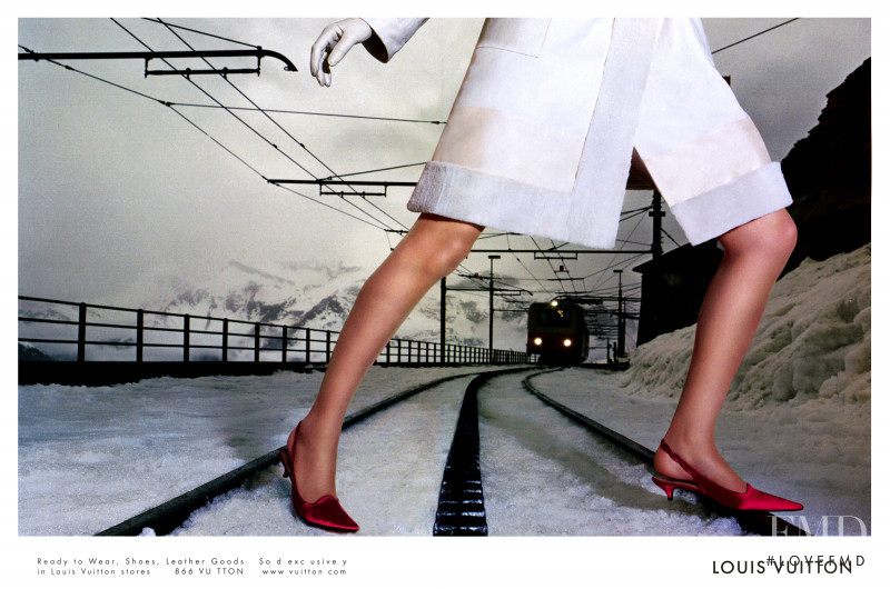 Eva Herzigova featured in  the Louis Vuitton advertisement for Autumn/Winter 2002
