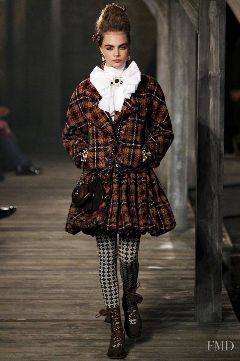 Cara Delevingne featured in  the Chanel fashion show for Pre-Fall 2013