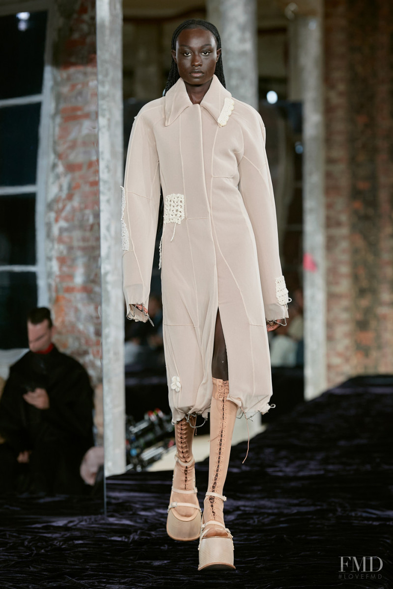 Nyagua Ruea featured in  the Acne Studios fashion show for Spring/Summer 2022