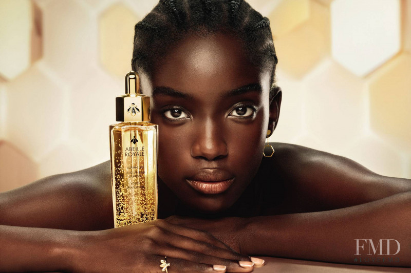 Maty Fall Diba featured in  the Guerlain Abeille Royale advertisement for Autumn/Winter 2021