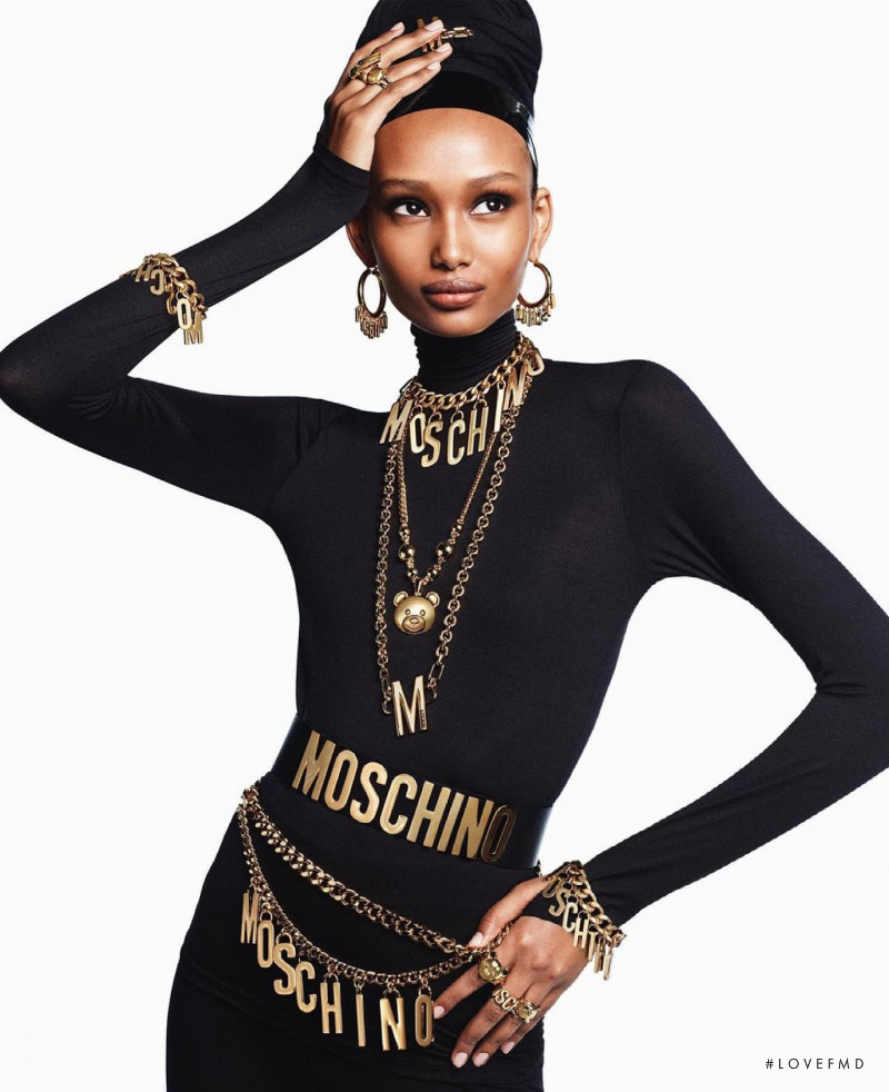 Ugbad Abdi featured in  the Moschino advertisement for Pre-Fall 2021