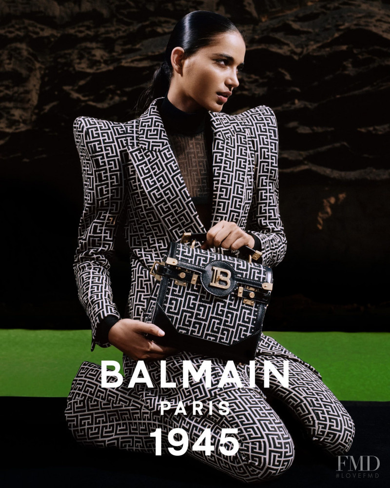 Ame Amrit featured in  the Balmain 1945 Bags advertisement for Spring/Summer 2021