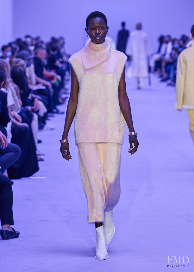 Anyiel Majok featured in  the Jil Sander fashion show for Spring/Summer 2022