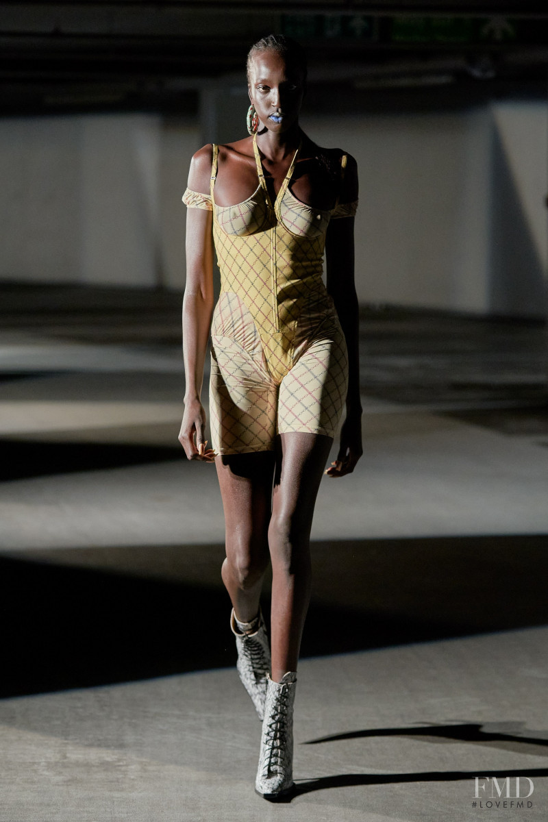 Nyaueth Riam featured in  the Knwls fashion show for Spring/Summer 2022