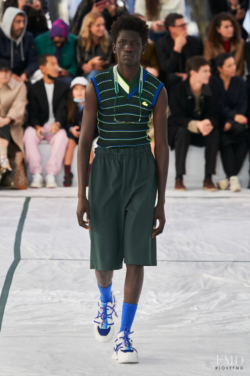 Moustapha Sy featured in  the Lacoste fashion show for Spring/Summer 2022