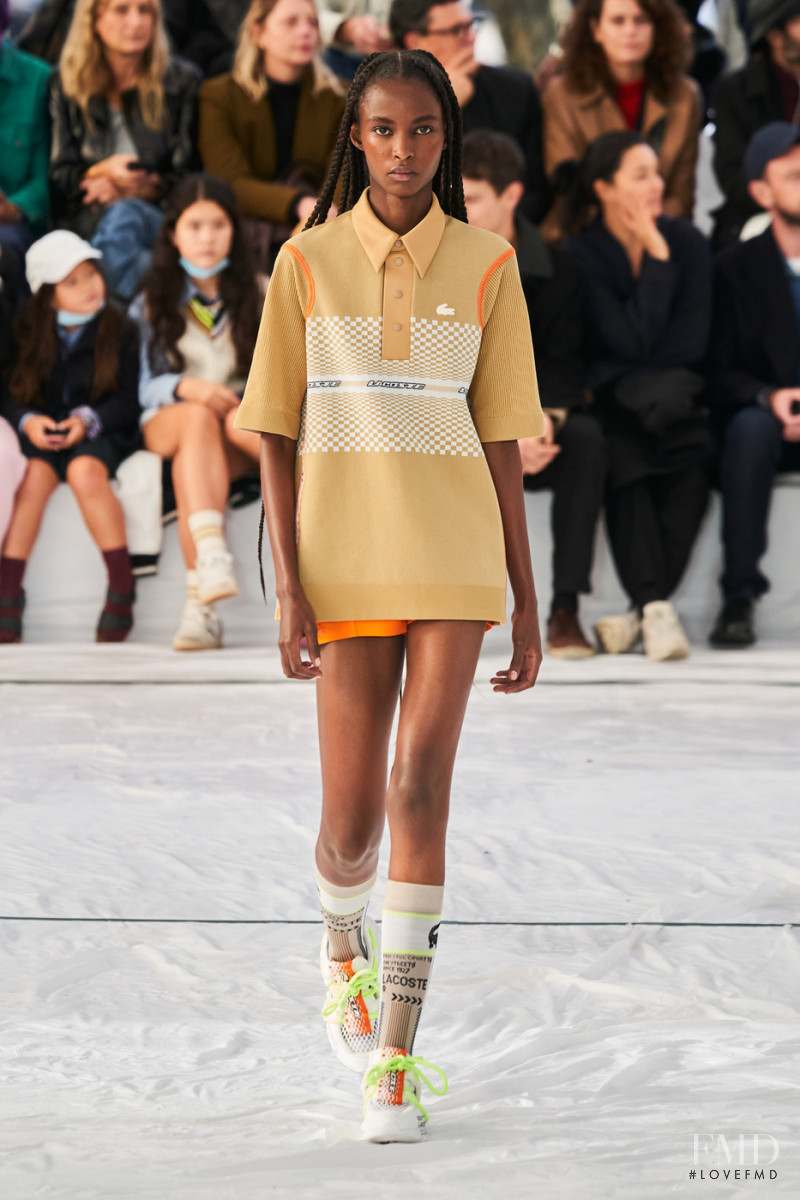Christine Munezero featured in  the Lacoste fashion show for Spring/Summer 2022