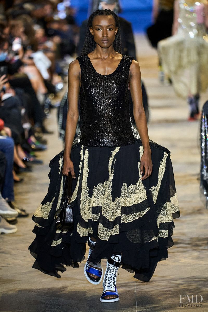 Amelie Nsengiyumva featured in  the Louis Vuitton fashion show for Spring/Summer 2022