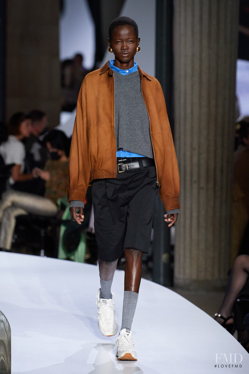 Anyiel Majok featured in  the Miu Miu fashion show for Spring/Summer 2022