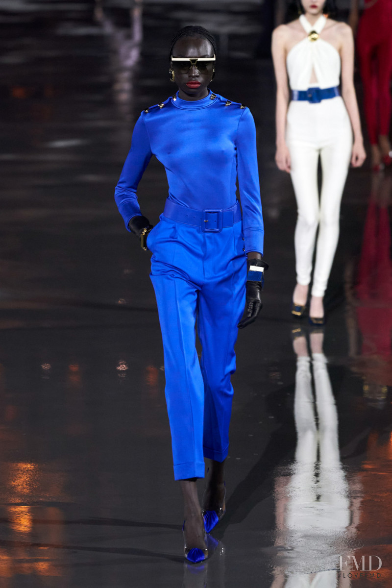 Nyagua Ruea featured in  the Saint Laurent fashion show for Spring/Summer 2022