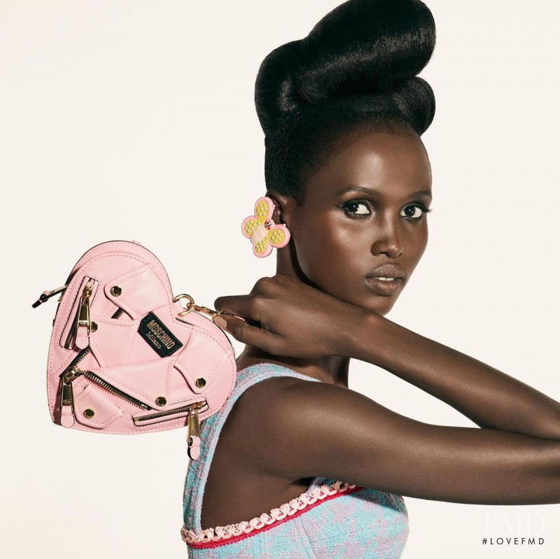 Amar Akway featured in  the Moschino advertisement for Spring/Summer 2022